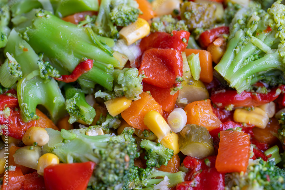 Homemade fresh boiled vegetables, broccoli, carrots, corn, pickled cucumbers and capia pepper healthy nutrition lifestyle concept.