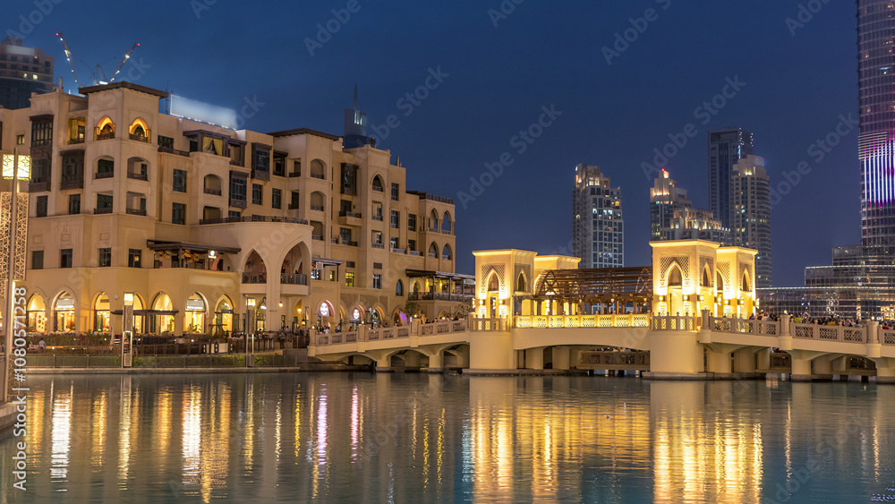 Fototapeta premium The bridge near the biggest musical fountain in Dubai day to night timelapse. Dubai, UAE