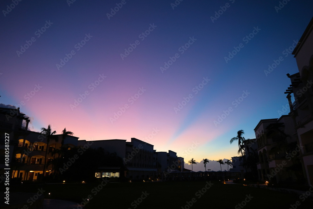 Fototapeta premium Beautiful night sky painted with stunning hues of purple, blue, and orange, creating a breathtaking display of color and tranquility