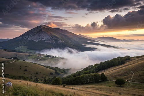 Mysterious fog rolls in over mount cucco peak at sunset in umbria Italy, mount cucco, sunset hills, rural Umbria, misty peaks, misty evening photo