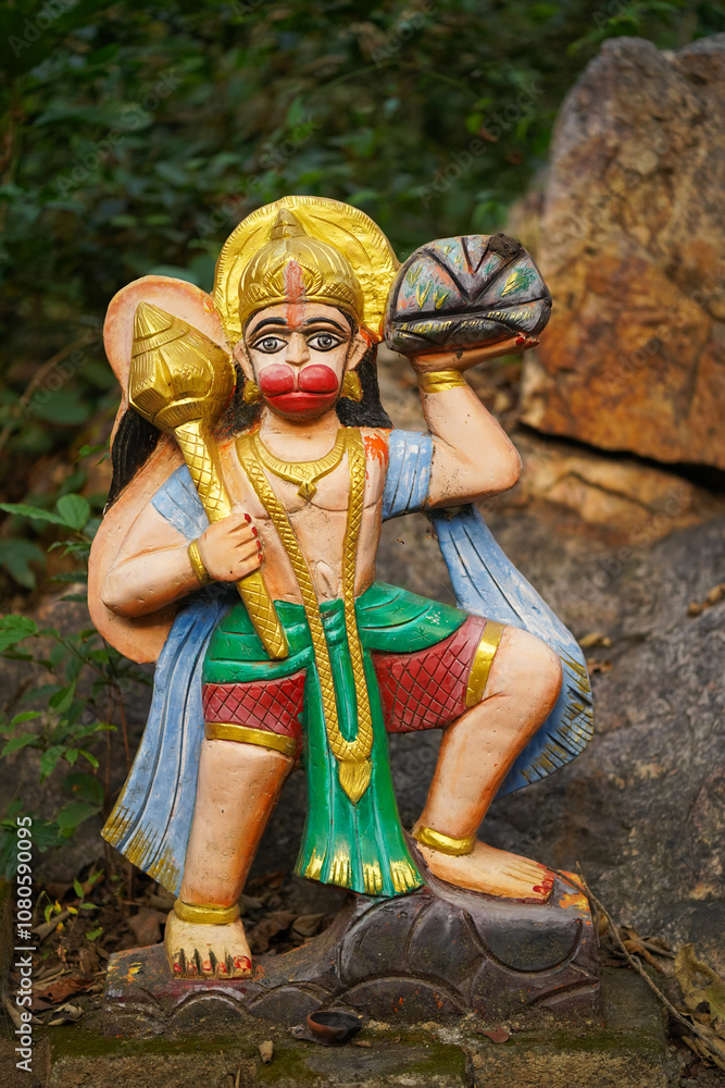 Hanuman forest indian goddess, sacred idol in jungle, nature-surrounded deity statue, van devi idol in forest, ancient temple in woods, rural deity sculpture, forest shrine stock photo.
Hanuman forest indian goddess, sacred idol in jungle, nature-surrounded deity statue, van devi idol in forest, ancient temple in woods, rural deity sculpture, forest shrine stock photo.