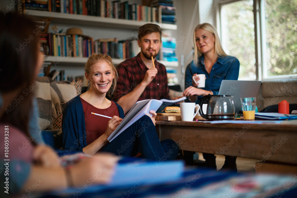 Group of friends studying together at home with coffee and notebooks Group of friends studying together at home with coffee and notebooks