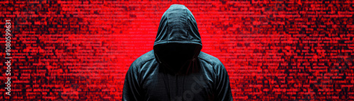 Mystery figure in a hoodie standing in front of a red digital background, symbolizing anonymity and cyber themes.