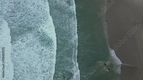 Splashing Waves On The Sand Of A Beach In Caión, A Laracha, Spain - Drone Shot photo