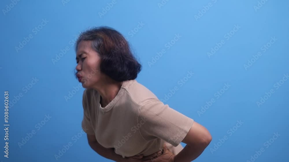 Stomach liver kidney pain. Sick ill senior old woman experiencing painful ache in stomach Stomach liver kidney pain. Sick ill senior old woman experiencing painful ache in stomach