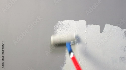 Painting White Wall with Gray Paint Using Roller - Smooth Color Transition in Renovation Footage