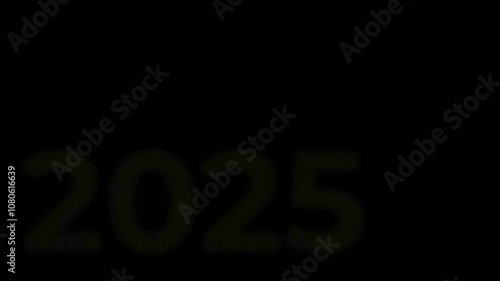 The inscription 2025, shimmering with bright colors, appearing on a black background. New Year's motive. New Year. Lettering, calligraphy. Video art graphics