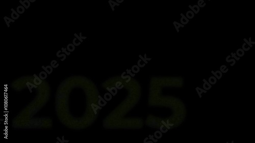 The inscription 2025, shimmering with bright colors, appearing on a black background. New Year's motive. New Year. Lettering, calligraphy. Video art graphics