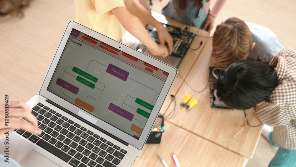 Top view of smart caucasian teacher coding engineering prompt and generated AI while diverse children learning main board. Group of diverse student working together and fixing main board. Pedagogy. Top view of smart caucasian teacher coding engineering prompt and generated AI while diverse children learning main board. Group of diverse student working together and fixing main board. Pedagogy.