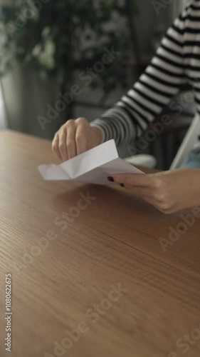 woman hand open and receive letter, invitation or notification photo