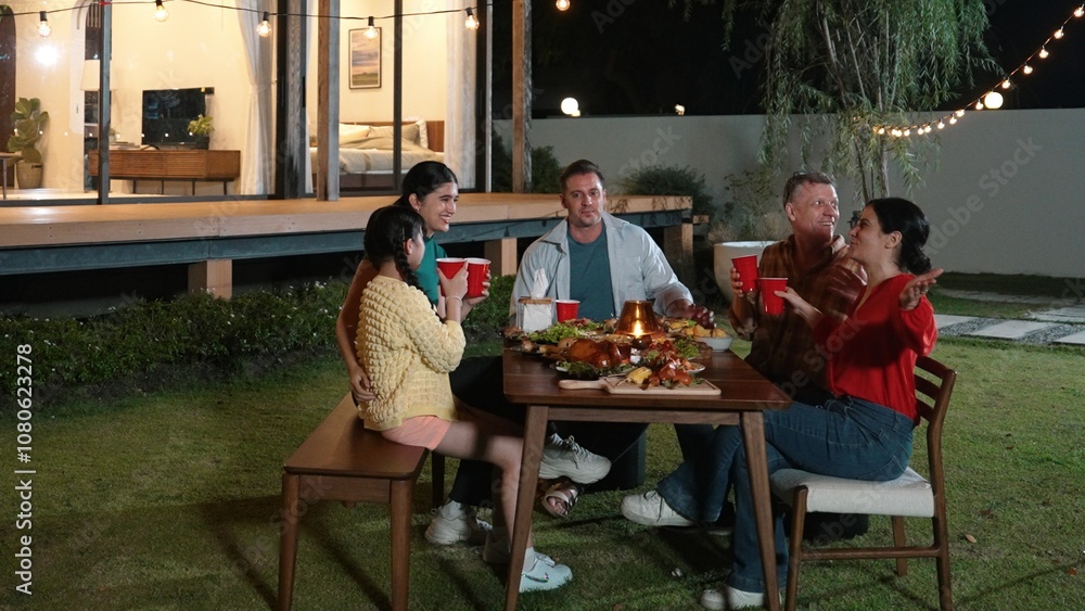 Family gather celebrate holiday. Parents, grandparents and girl together to talk and have dinner party food. Outdoor activity for spending time with multigeneration cross generation gap. Divergence. Family gather celebrate holiday. Parents, grandparents and girl together to talk and have dinner party food. Outdoor activity for spending time with multigeneration cross generation gap. Divergence.