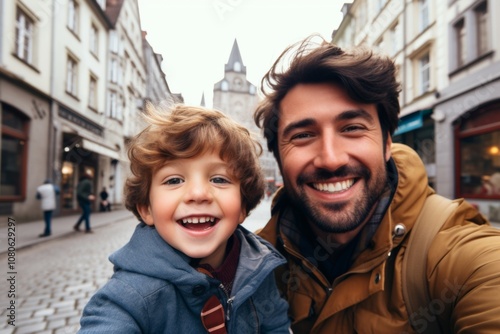 Close up of a father and his son taking selfie while walking in the city