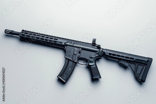 A modern black AR-platform rifle is showcased on a white surface, emphasizing its design and features photo