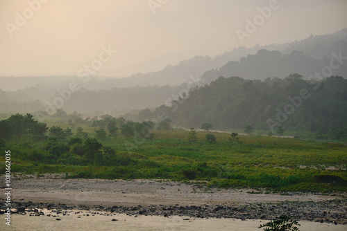 The Beki river flows past the wooded hills through a  valley in Manas National Park in Assam, India