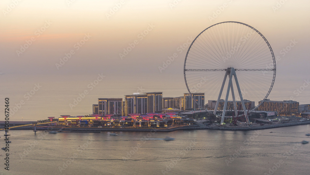 Obraz premium Bluewaters Island in Dubai aerial day to night timelapse after sunset.