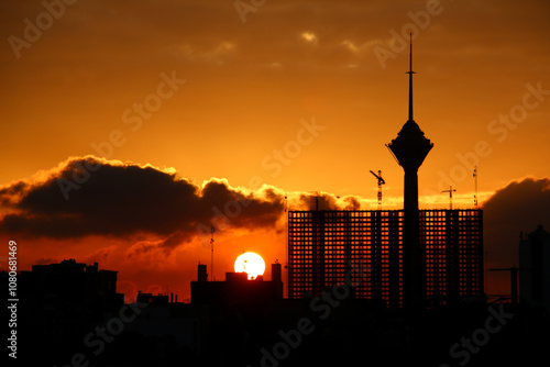 sunset over the city, City sunset, City silhouette, City silhouette against the cloudy sunset sky, Tehran-Iran, Milad tower silhouette