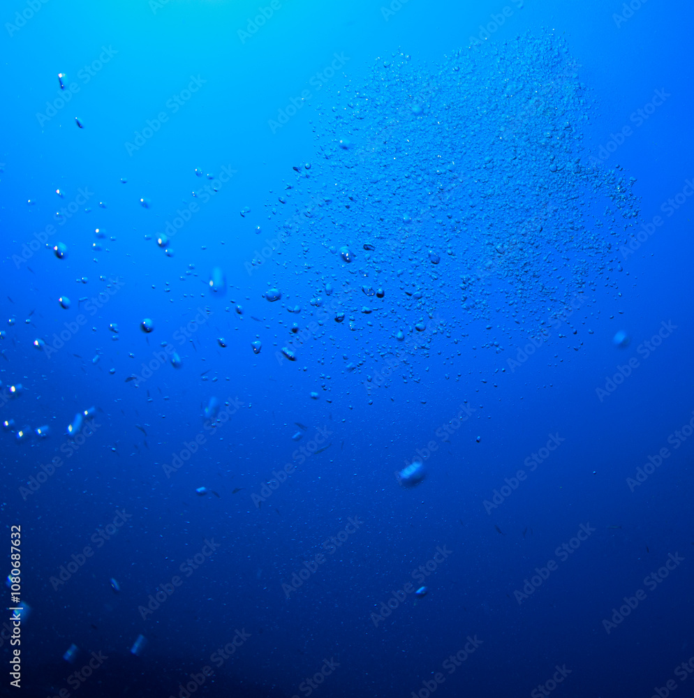 Scattered bubbles with the blue of the ocean in the background Scattered bubbles with the blue of the ocean in the background