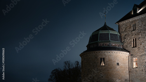 One of the towers of Örebro castle by night photo