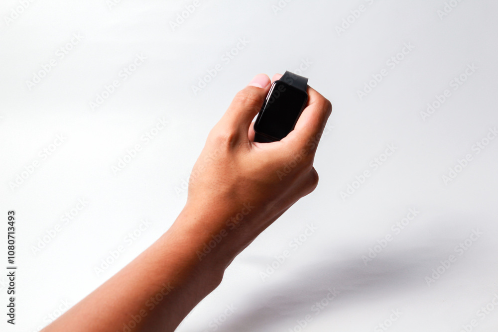 Male hand holding smart watch on isolated background Male hand holding smart watch on isolated background