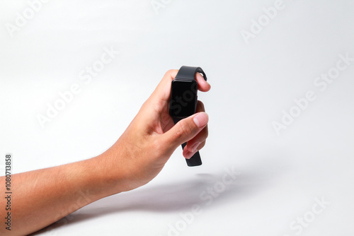 Male hand holding smart watch on isolated background