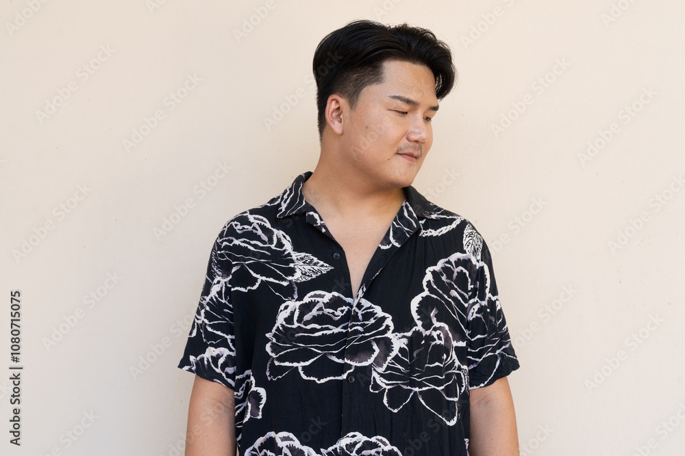 Portrait of Handsome Young Asian Man Against Plain Background Portrait of Handsome Young Asian Man Against Plain Background
