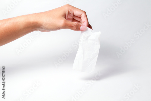 Hand holding dove plastic wrap on isolated white background