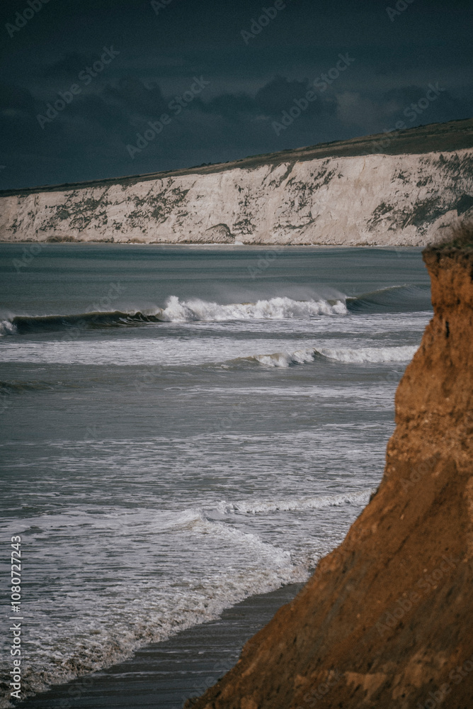 Fototapeta premium Waves in the sea near the coastal beach of an island