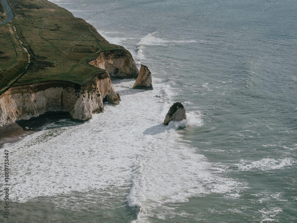 Fototapeta premium Drone shot of an island and waves near it