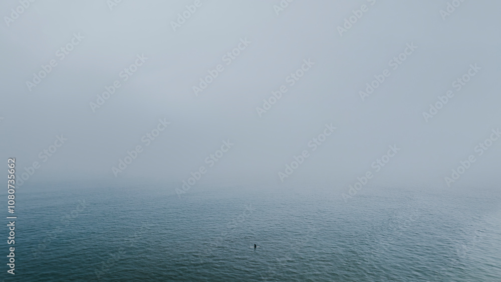 View of an ocean in a foggy weather View of an ocean in a foggy weather