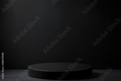 Black circular podium on dark background, minimalistic design, suitable for product display or photography