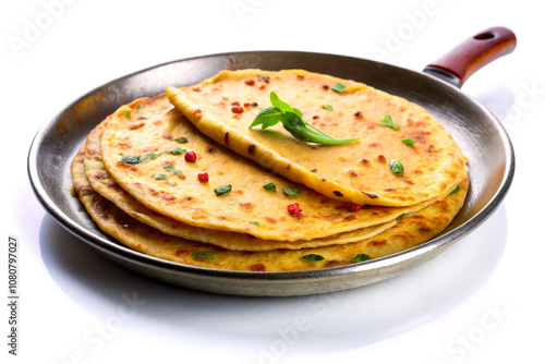 Metal tawa with herbal bread, isolated on white background photo