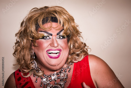 Funny drag queen poses in the studio.