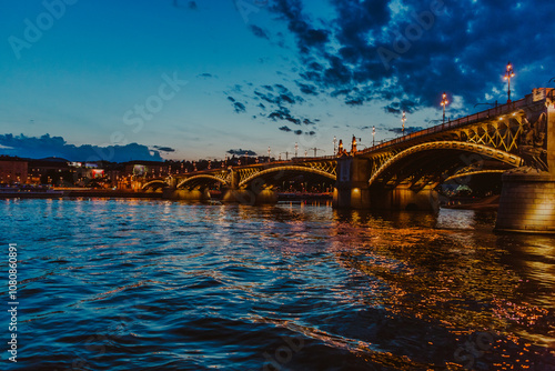 Margit Bridge (hid) during dusk - photo taken from the boat on river Danube photo