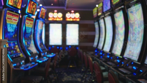Photography Blurred view of brightly lit slot machines in a colorful las vegas casino, capturing the vibrant indoor atmosphere