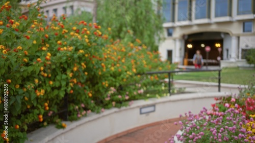 Blurred woman walking in a lush outdoor street in monaco, surrounded by vibrant flowers and buildings, creating a luxury and defocused atmosphere.