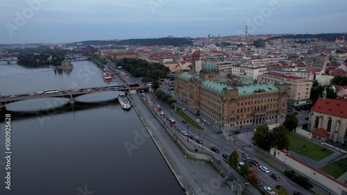 Beautiful Aerial footage of Prague Vltava river, the Ministry of Industry and Trade its ironic streets and buildings and the Old Royal Palace -St. Vitus Cathedral photo