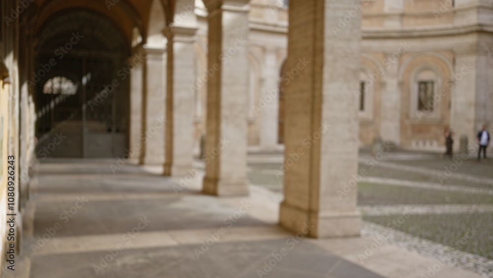 Fototapeta premium Blurred view of an old university campus outdoors with a focus on historic architecture and defocused background, creating a serene educational environment, no identifiable people visible.
