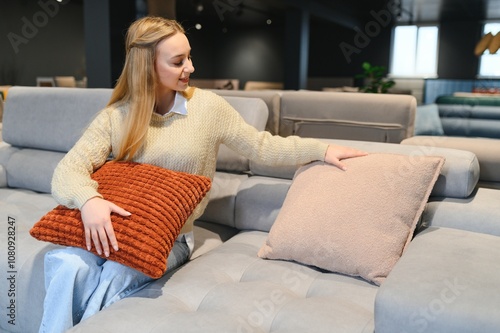 young woman shopping for furniture, sofa and home decor in store