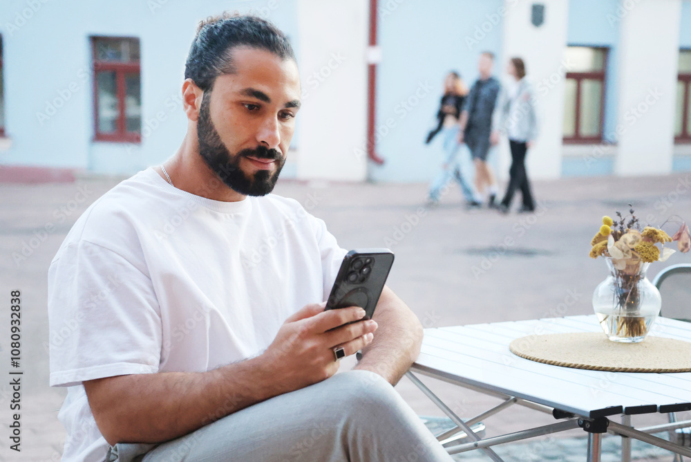 Guy with a beard with a smartphone. Guy with a beard with a smartphone.