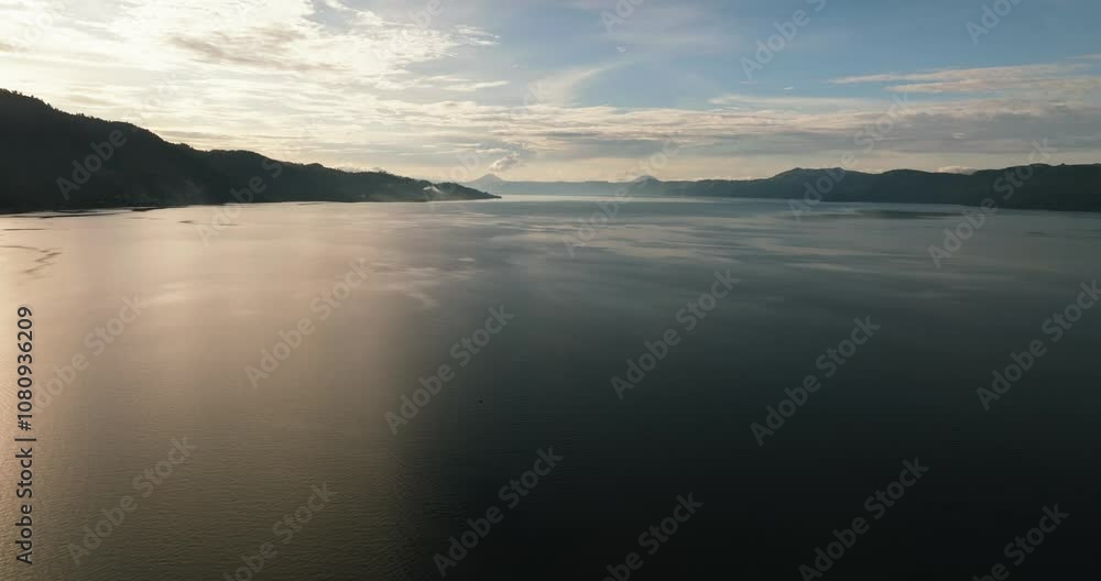 Lake Toba and Samosir Island at sunset view from above. Sumatra, Indonesia. Lake Toba and Samosir Island at sunset view from above. Sumatra, Indonesia.