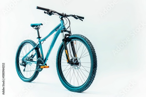 Teal mountain bike on white background.