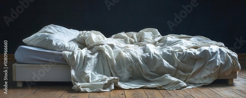 Empty bed with crumpled sheets, feeling of loneliness and abandonment, dim lighting photo