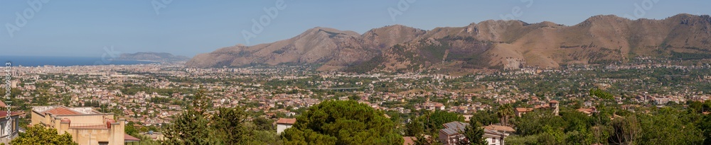 Obraz premium Panoramic view of Palermo city and mountains from Monreale town, Sicily, Italy, vast coastal cityscape framed by mountains in the background, coastline and urban landscape