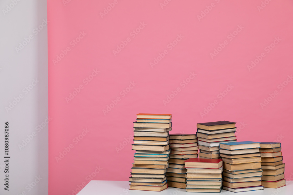 many stacks of books to study in the university library as a background many stacks of books to study in the university library as a background
