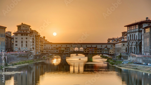 Sunset view of Florence Ponte Vecchio over Arno River in Florence timelapse, Italy.