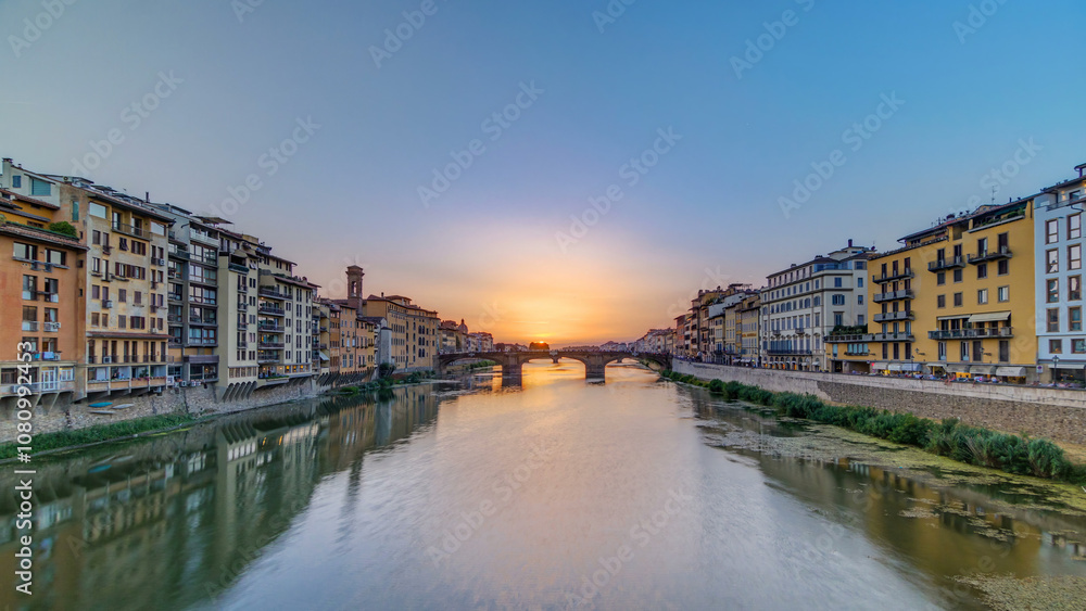Cityscape view on Arno river with famous Holy Trinity bridge timelapse on the sunset in Florence Cityscape view on Arno river with famous Holy Trinity bridge timelapse on the sunset in Florence