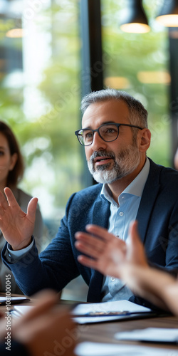 Obraz na płótnie Real Estate Advisor Engages Clients With a Detailed Marketing Strategy for Apartment Sales in a Modern Boardroom Setting w salonie