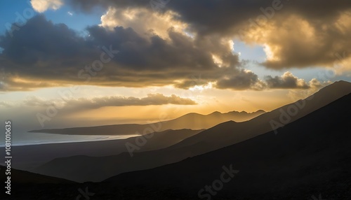 Stunning mountain silhouettes against a sunset sky, showcasing natural beauty.