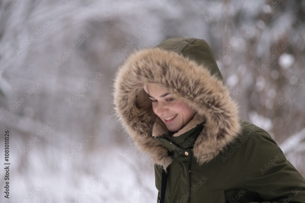 Beautiful young girl walking with a purebred retriever near a snowy forest in winter. Beautiful young girl walking with a purebred retriever near a snowy forest in winter.