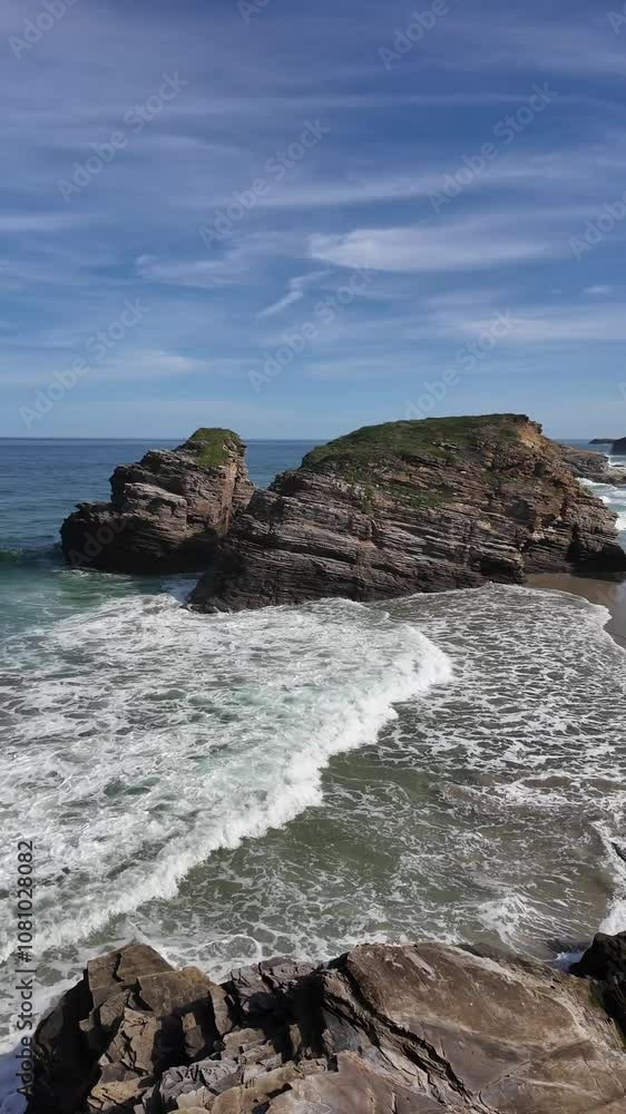 Expansive beach scene at Playa de las Catedrales in Lugo, Galicia, featuring striking rocky cliffs and gentle ocean waves.
Expansive beach scene at Playa de las Catedrales in Lugo, Galicia, featuring striking rocky cliffs and gentle ocean waves.